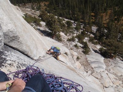 Working hard to get a cam out. John's hands belaying.