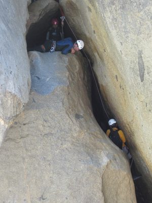Colin watching as Eliah rappels.