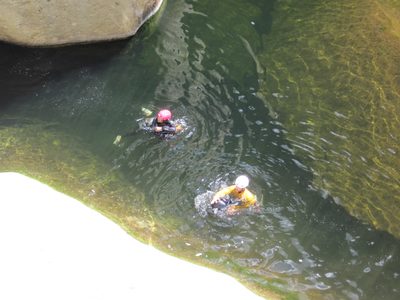 Aditi and Eliah swimming at the bottom.