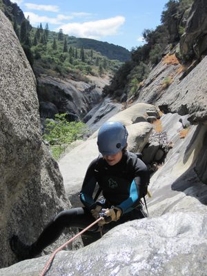 Monica rappelling. Good view from up here: you can see a...