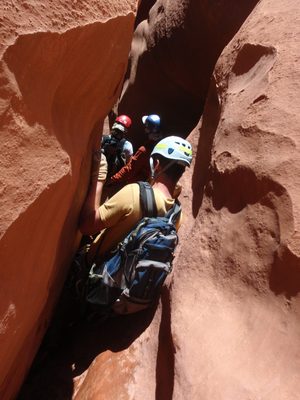 Climbing through an awkward section that was both narrow...