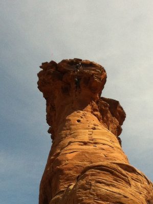 Climber with a large pack struggles with the final 5.9+...