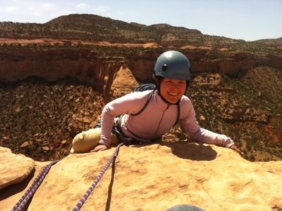 Monica, downclimbing 10 feet to the final anchor while I...