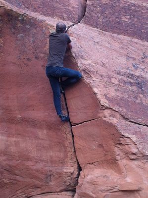 John bouldering on a short hand crack.