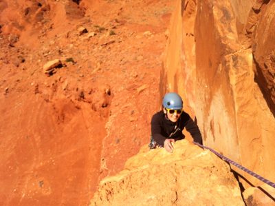 Monica, having passed the crux 5.10+ traverse on Pitch...
