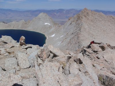 Joel climbs up over some rocks on the East Ridge of...