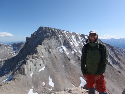 John, on the summit of Mt. Russell, with Mt. Whitney in...