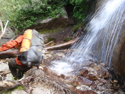 Joel skirts around a waterfall on the hike out.