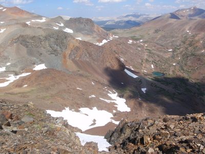 Looking down a couloir to the top of a small glacier. ...