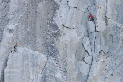 Alex on Dolt Tower, Hans leading on toward El Cap Tower....