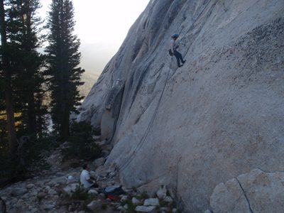 Rappelling back to the base while Jay gives a belay. In...