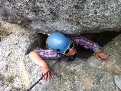 Monica coming through the cave to the summit of the tower.