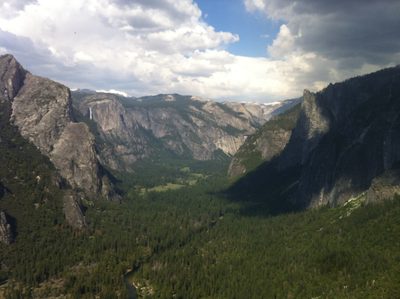 Yosemite Valley including roaring Yosemite Falls at the left.