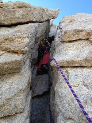 John entering the chimney (darn backpack) at the start...