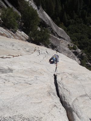 Marlin throwing in a hand jam on pitch 3 of Super Slide (5.9).