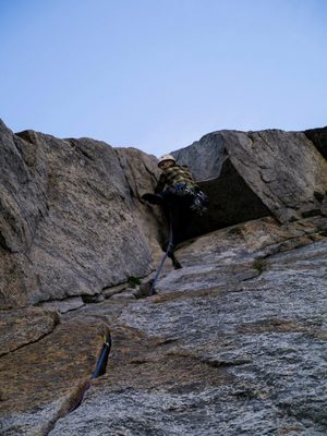 Pulling through the roof on pitch 3.