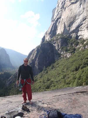 John at the top of Manure Pile Buttress, relaxing his feet.