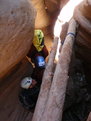 Joel setting up to rappel in Pine Creek Canyon while...