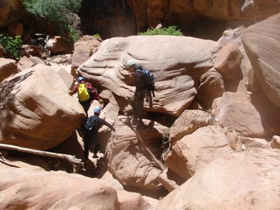 Navigating a wider, sunnier section of the canyon.