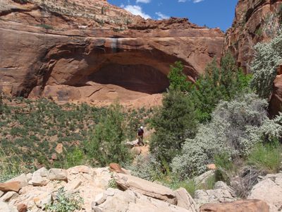 A giant arch on one side of Pine Creek Canyon, and Andy.