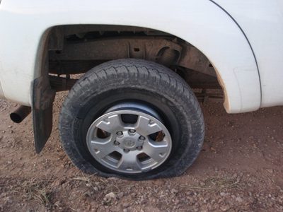 Major bummer!  Andy's truck gets a severe flat on the...