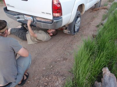 Joel getting the spare out from under the back of the truck.