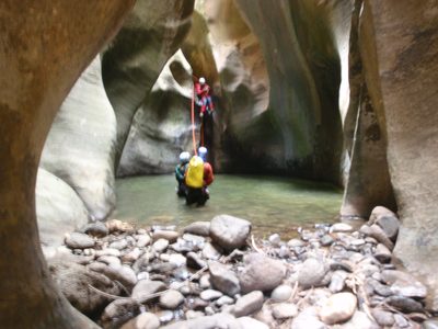 Andy finishes of one of the first rappels in Kolob...