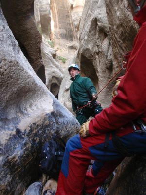 Mike on rappel (green) while Andy watches from above.