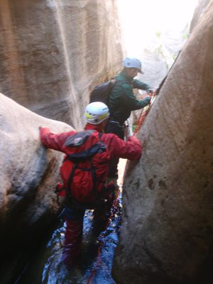 Andy snaps a picture while Mike sets up to go on rappel.