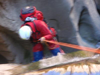 A blurry shot, but I like it all the same.  Andy on rappel.