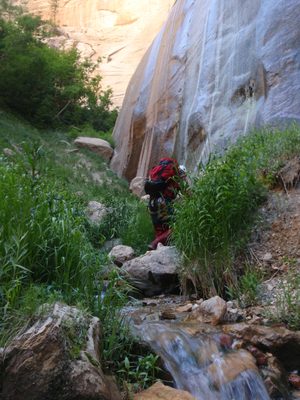 Andy goes to inspect the base of the falls.