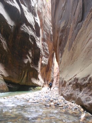 Mike leads the way across a dry patch of river rocks.