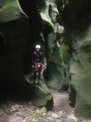 John, standing in a section of narrows in Bear Canyon.