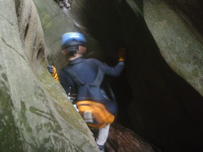 Monica negotiates around some boulders in Bear Canyon.
