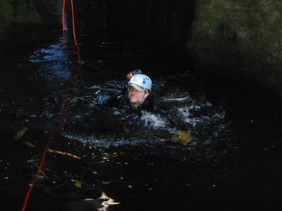 Mike swimming out of the pothole.  We were lucky that...