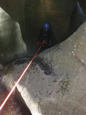Monica rappels into the next series of potholes.