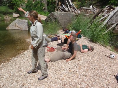 Meredith skips a rock while the rest of us laze about on...
