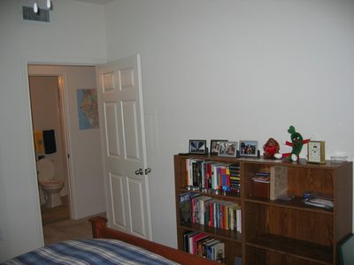 Book shelfs across from the bed