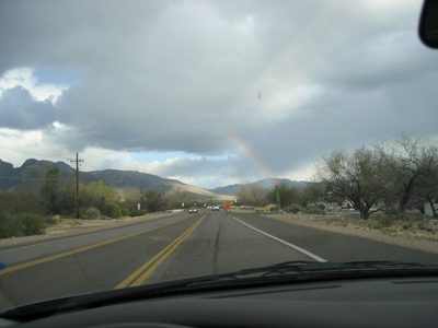 Should one really try to photograph a rainbow while driving?