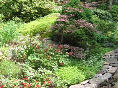 The front of the corner with red impatiens and sweet ?...
