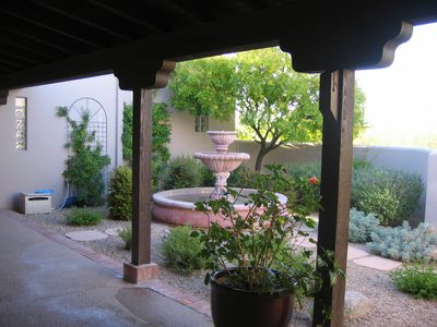 Courtyard with potted hibiscus.