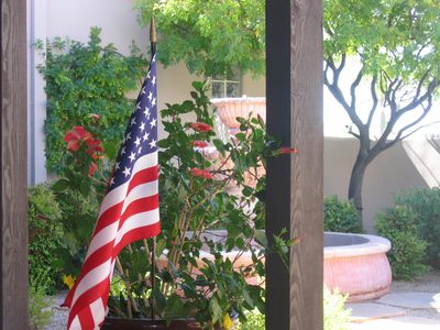 Flags in each of the hibiscus pots to welcome Memorial...