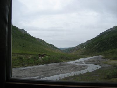 This side of the bridge, the valley is V-shaped, caused...