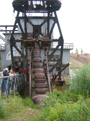 This is a dredge.  The buckets go down in the stream,...