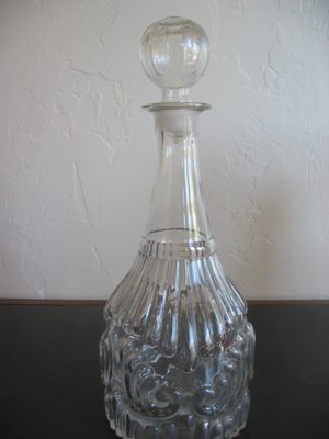 Decanter with ribbed ball top and decorative body; maybe...
