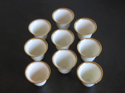 Nine tiny (2 oz?) demitasse cups.  No saucers.