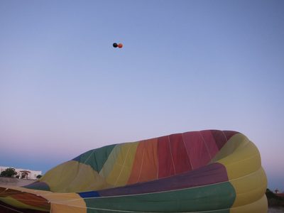 Send couple balloons (small) aloft to test the direction...