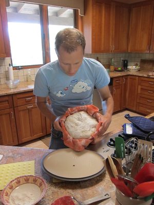 Into the improvised flat cast iron pan (aka the top of a...