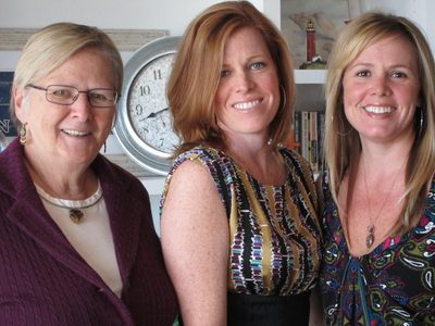 The same three ladies looking at the camera.