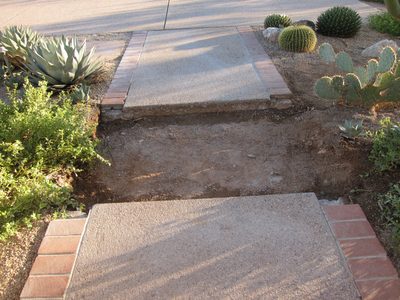 Also saw cut the pavement out front which had been...